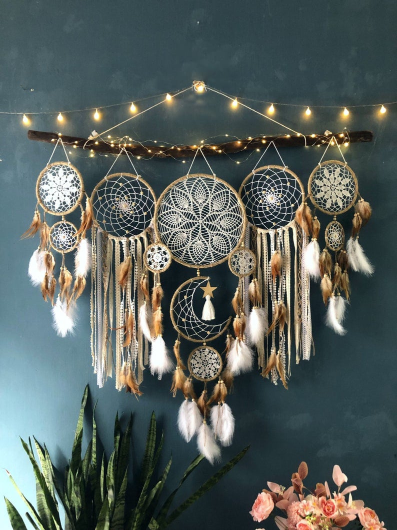 Dream catcher moon and stars hanging over the bed