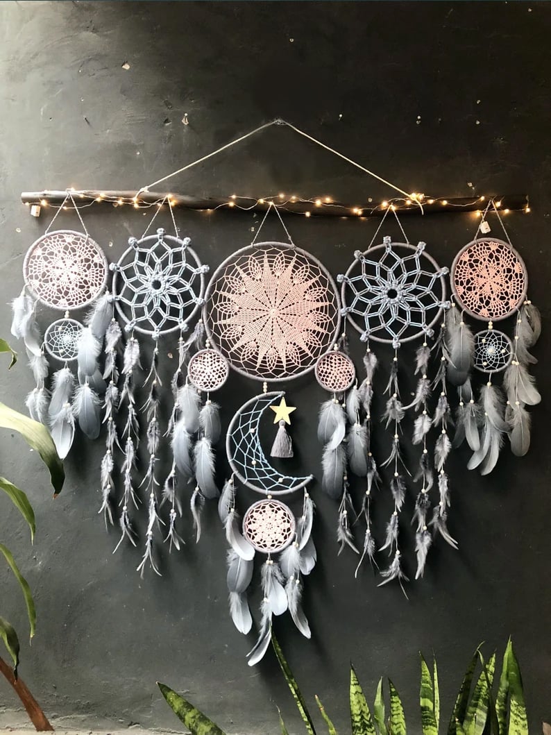 Dream catcher moon and stars hanging over the bed