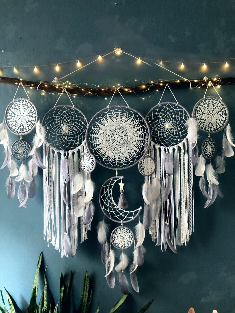 Dream catcher moon and stars hanging over the bed