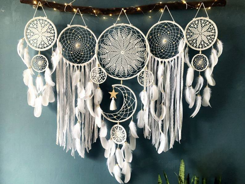 Dream catcher moon and stars hanging over the bed