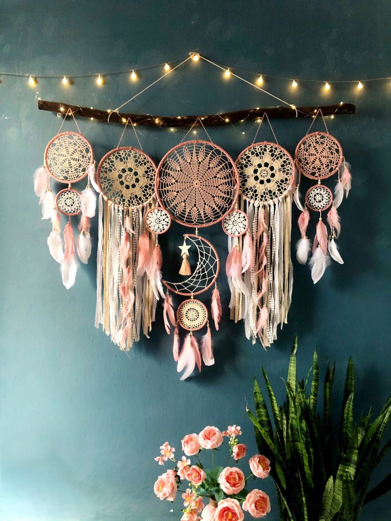 Dream catcher moon and stars hanging over the bed