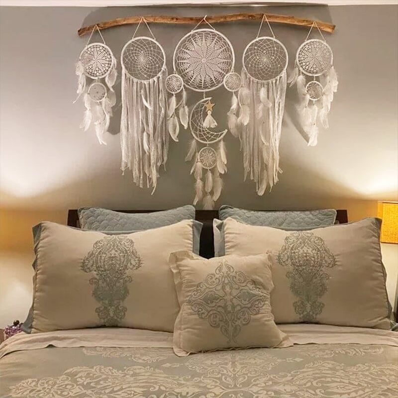 Dream catcher moon and stars hanging over the bed